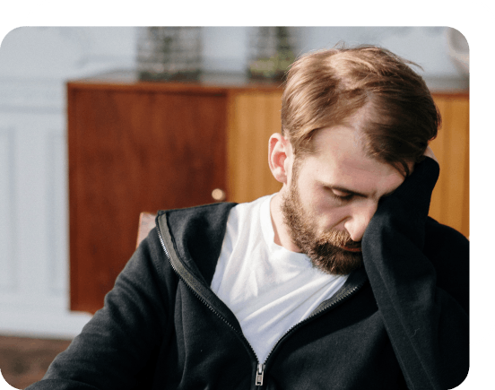 Man facepalming while in eating disorder counselling.